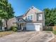 Charming two-story home with a well-manicured front yard and a two-car garage at 3511 Dominion Green Dr, Charlotte, NC 28269