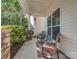 Charming covered front porch featuring stone accents and comfortable seating at 3511 Dominion Green Dr, Charlotte, NC 28269