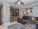 Cozy upstairs living room with a grey sectional, neutral walls, and carpet at 3511 Dominion Green Dr, Charlotte, NC 28269
