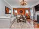 Large living room with an ornate ceiling fan, gas fireplace and large area rug at 3511 Dominion Green Dr, Charlotte, NC 28269