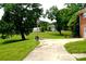 Large lot with a basketball court, spacious yard, and a view of the home next door at 405 Wesley Heights Dr, Albemarle, NC 28001