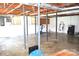 An unfinished basement features exposed beams, support beams, and workout equipment at 405 Wesley Heights Dr, Albemarle, NC 28001