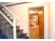 Stairway down to a kitchen area with an interior door at 405 Wesley Heights Dr, Albemarle, NC 28001