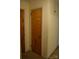 Hallway featuring neutral color palette, neutral carpeting, and paneled doors at 405 Wesley Heights Dr, Albemarle, NC 28001