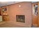 Cozy living room with a brick fireplace and built-in shelves at 405 Wesley Heights Dr, Albemarle, NC 28001