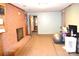 Spacious living room with a brick fireplace, neutral walls, and carpet with plenty of space for activities at 405 Wesley Heights Dr, Albemarle, NC 28001