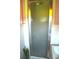 Shower with white tiled walls and a glass door at 405 Wesley Heights Dr, Albemarle, NC 28001