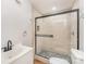 Updated bathroom featuring tiled shower with glass door and modern vanity at 408 Orange St, Shelby, NC 28150