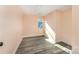 Bright bedroom with wood-look flooring and natural light from a new window at 408 Orange St, Shelby, NC 28150