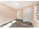 Bedroom featuring wood-look floors, natural light and two closets at 408 Orange St, Shelby, NC 28150