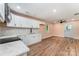 Modern kitchen features white cabinets, stainless appliances, and an open floor plan at 408 Orange St, Shelby, NC 28150