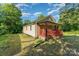 Quaint home exterior with red porch and green yard at 408 Orange St, Shelby, NC 28150