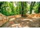 Private backyard with a wooden fence and tree coverage at 506 Broadway Ct, Statesville, NC 28677