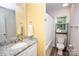 Well-lit bathroom with granite countertop vanity, mirror, and shower/tub combination at 506 Broadway Ct, Statesville, NC 28677