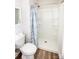Bathroom featuring a toilet and shower with a floral curtain at 506 Broadway Ct, Statesville, NC 28677