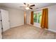 Inviting bedroom featuring neutral walls, plush carpeting, and a window with curtains at 506 Broadway Ct, Statesville, NC 28677