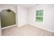 Comfortable bedroom featuring a cozy atmosphere and a window for natural light at 506 Broadway Ct, Statesville, NC 28677