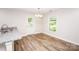 Eat in kitchen area featuring a granite countertops, hardwood floors, and natural light at 506 Broadway Ct, Statesville, NC 28677