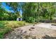 Landscaped backyard featuring a fire pit and an outdoor gazebo at 506 Gold St, Shelby, NC 28150