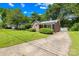 A side view showcases a brick home with a well-kept lawn and a concrete driveway, emphasizing its setting at 506 Gold St, Shelby, NC 28150