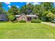 Charming brick home with a well-manicured front lawn and covered porch, creating a welcoming curb appeal at 506 Gold St, Shelby, NC 28150