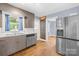 Kitchen featuring stainless steel appliances, wood floors, and ample cabinet space for modern living at 506 Gold St, Shelby, NC 28150