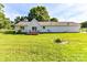 Spacious back yard with a deck, mature trees, and a well-manicured lawn at 5105 Hampton Meadows Rd, Monroe, NC 28110