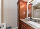 Bathroom features wood cabinets, granite countertops and a shower with tub at 5105 Hampton Meadows Rd, Monroe, NC 28110