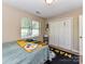 Cozy bedroom featuring a window, closet, and carpet, decorated with team-themed items at 5105 Hampton Meadows Rd, Monroe, NC 28110