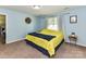 Bedroom with blue walls, carpeted floor, and window with curtains at 5105 Hampton Meadows Rd, Monroe, NC 28110