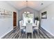 Bright dining area featuring modern white table set and a chandelier at 5105 Hampton Meadows Rd, Monroe, NC 28110