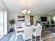 Bright dining area with seating for six and view to the living room and backyard at 5105 Hampton Meadows Rd, Monroe, NC 28110