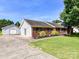 Charming red brick home with a well-manicured lawn and separate garage at 5105 Hampton Meadows Rd, Monroe, NC 28110