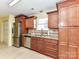 Well-lit kitchen features wood cabinets, stainless steel appliances and granite countertops at 5105 Hampton Meadows Rd, Monroe, NC 28110