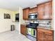 This kitchen features granite countertops, stainless steel appliances and wooden cabinets at 5105 Hampton Meadows Rd, Monroe, NC 28110