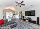 Spacious living room with vaulted ceilings, tv, and view into the dining room at 5105 Hampton Meadows Rd, Monroe, NC 28110
