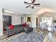 Living room with wood floors, grey sofa, opens up to a dining room at 5105 Hampton Meadows Rd, Monroe, NC 28110