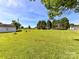 Expansive grassy lot with mature trees, providing privacy and scenic views at 5105 Hampton Meadows Rd, Monroe, NC 28110