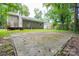 A backyard featuring a wooden deck and a concrete pad at 5424 Amado St, Charlotte, NC 28215