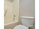 Bathroom featuring a tub with shower and toilet with neutral walls at 5424 Amado St, Charlotte, NC 28215