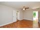 Bedroom featuring neutral walls, wood floors, and access to a balcony at 5424 Amado St, Charlotte, NC 28215