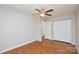Well-lit bedroom features hardwood floors, neutral walls, and a closet at 5424 Amado St, Charlotte, NC 28215