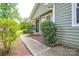 Inviting front porch and walkway bordered by lush greenery, leading to the home's entrance at 5424 Amado St, Charlotte, NC 28215