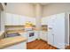 Clean kitchen with white appliances and lots of cabinet space at 5424 Amado St, Charlotte, NC 28215