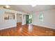 Bright living room with wood floors, skylight and open view to kitchen and dining area at 5424 Amado St, Charlotte, NC 28215