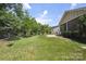 Expansive backyard with manicured lawn and a privacy fence, perfect for outdoor activities at 5524 Elk Knob Ct, Denver, NC 28037