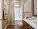 A classic bathroom with a tub and shower combination and a vanity with traditional wooden cabinets at 5524 Elk Knob Ct, Denver, NC 28037