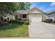 Charming home featuring a stone facade, manicured lawn, and a convenient two-car garage at 5524 Elk Knob Ct, Denver, NC 28037