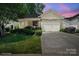Charming single-Gathering home with a stone and siding facade and a well-manicured front lawn at 5524 Elk Knob Ct, Denver, NC 28037