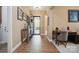 Inviting hallway showcasing tiled floors, natural light, and an inviting front door at 5524 Elk Knob Ct, Denver, NC 28037